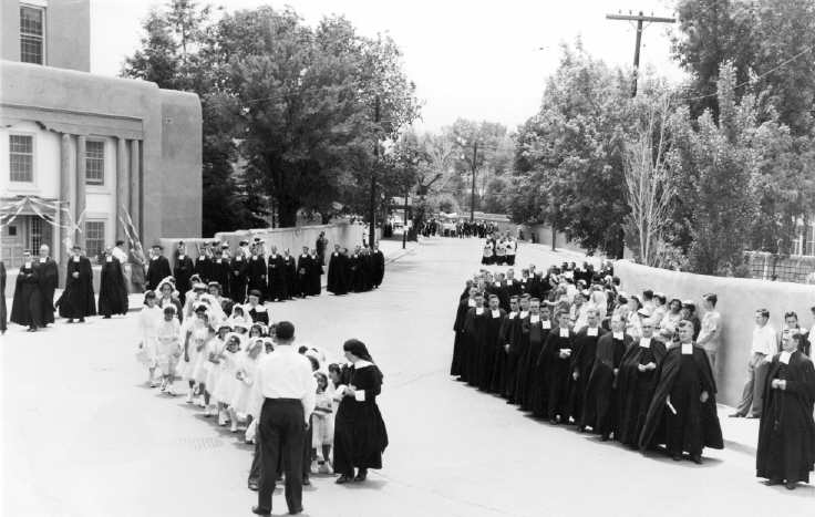 Brothers participate in a Corpus Christ procession in Santa Fe, NM, 1953.